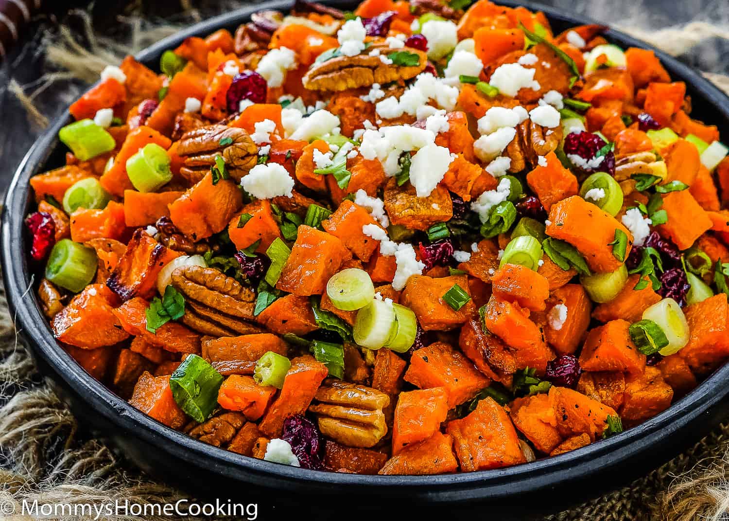Roasted Sweet Potato and Cranberry Salad in a black serving bowl.
