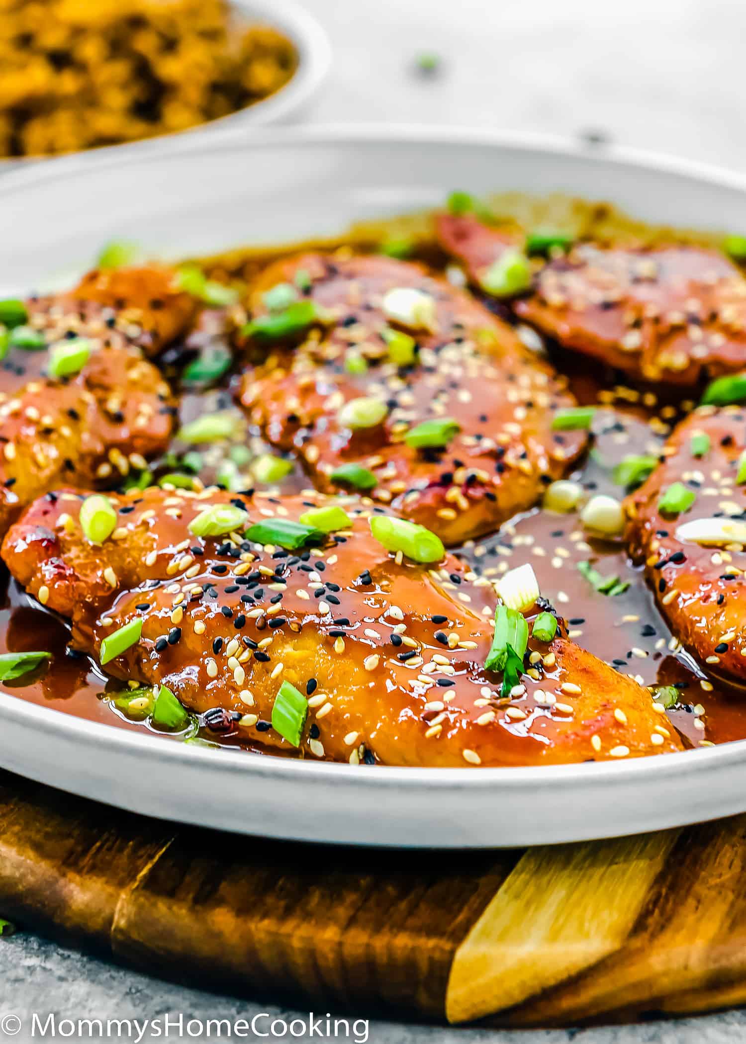 Asian-Style sticky Chicken Breasts in a white skillet.