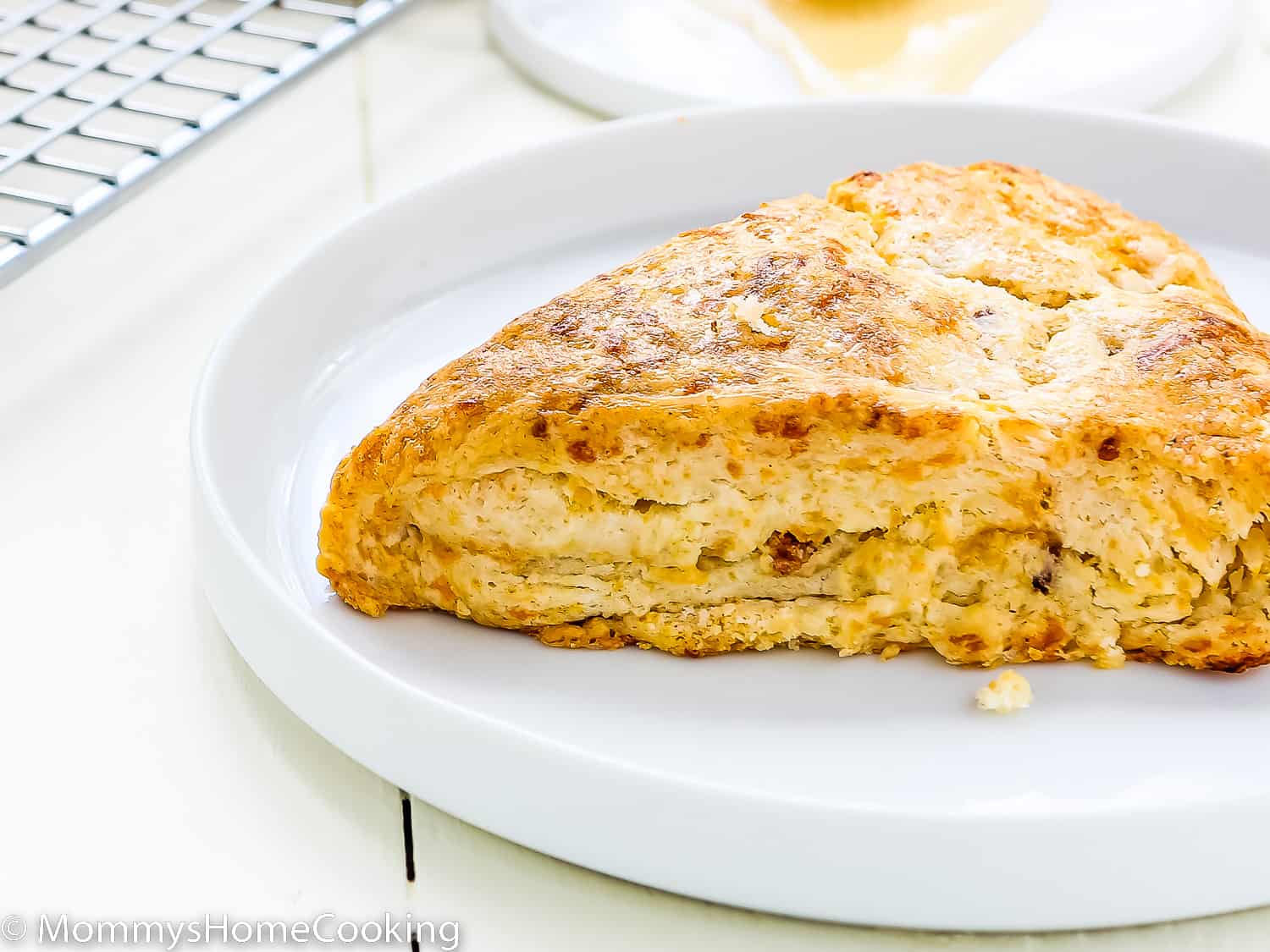 an eggless Bacon Cheddar Scone on a plate.