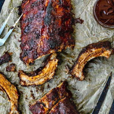 Barbecue Ribs over a piece of parchment paper.