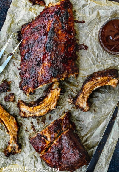 Barbecue Ribs over a piece of parchment paper.