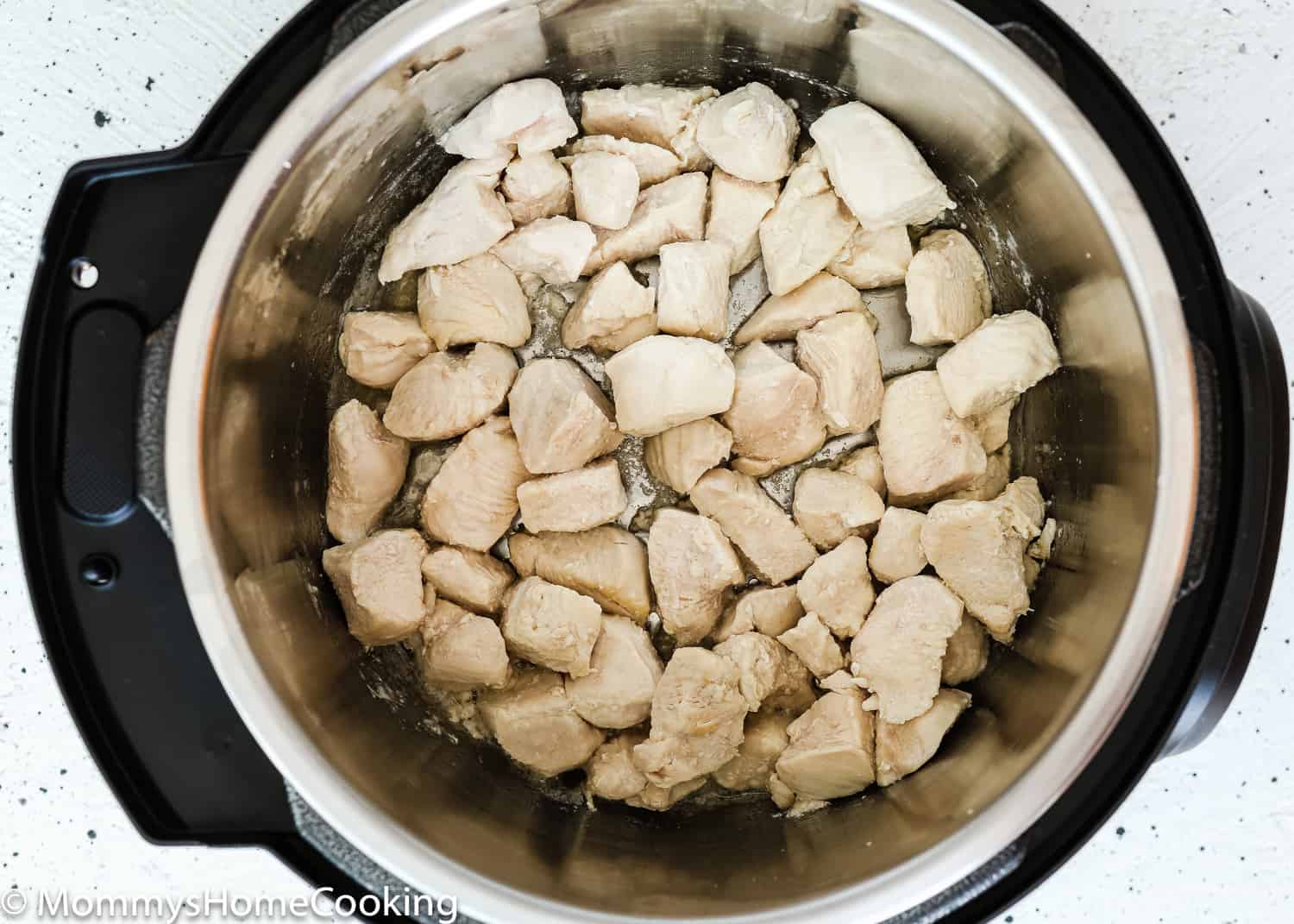 saute chicken breast in a pot.