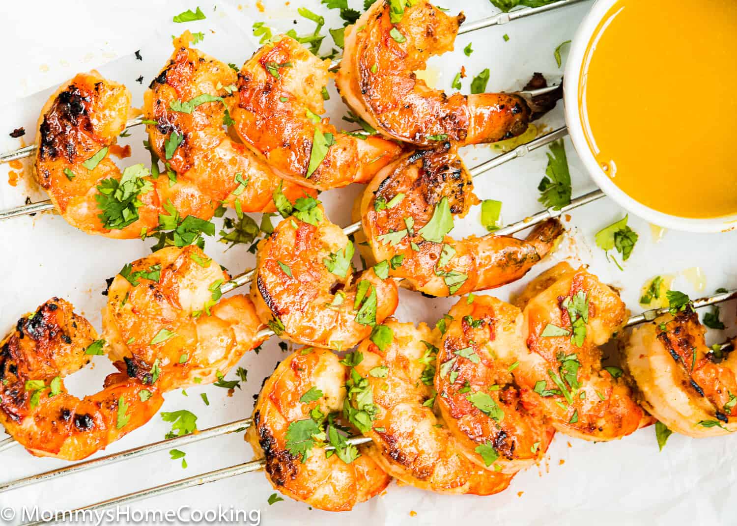 grilled shrimp on a white plate.