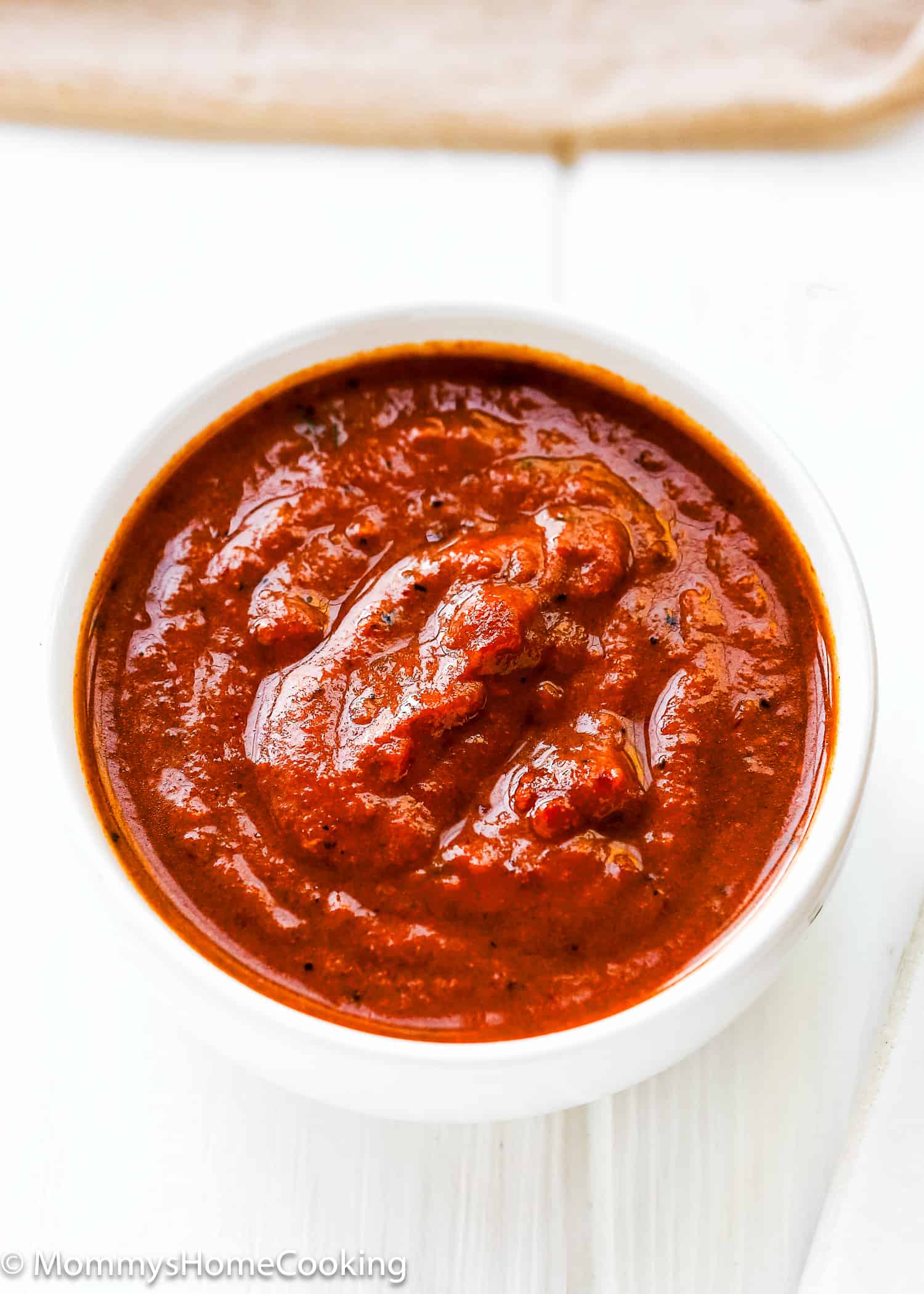 chipotle peppers in abodo sauce in a small white bowl.