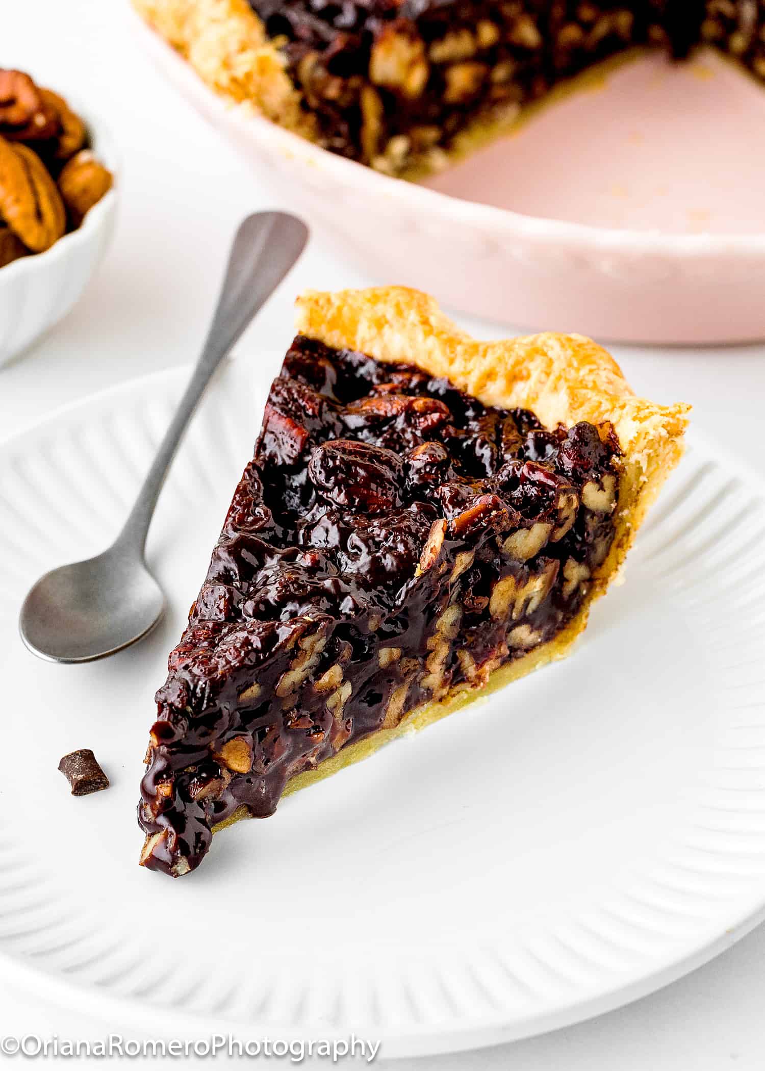 Eggless chocolate pecan pie slice on a plate. 