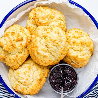 homemade Drop Biscuits in a serving plate with jam.