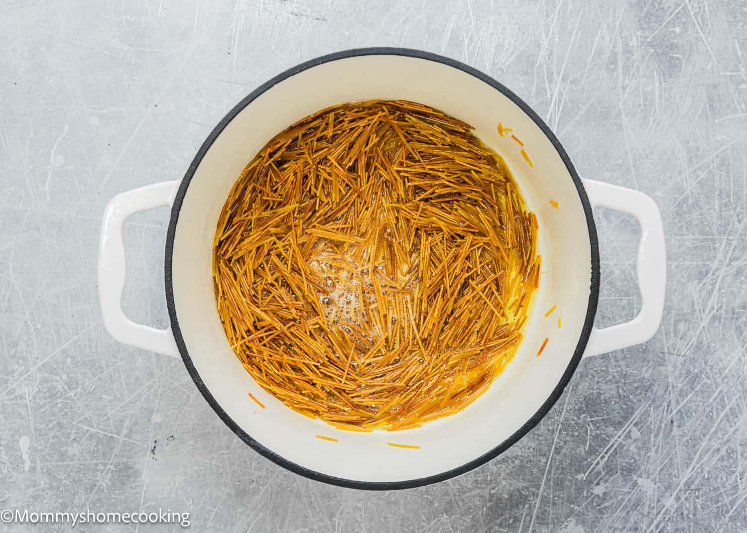 toasted vermicelli in a dutch oven pot.