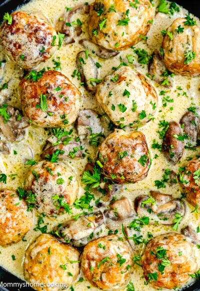 Stroganoff Meatballs with creamy sauce garnished with parsley.