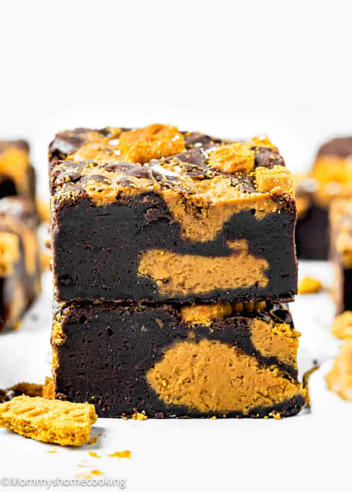 stack of two Biscoff Cookie Butter Brownies made without eggs over a white surface.