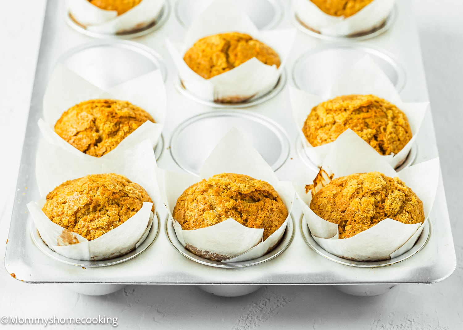 Carrot Cake Muffins (No Eggs & No Dairy) in a muffin pan.