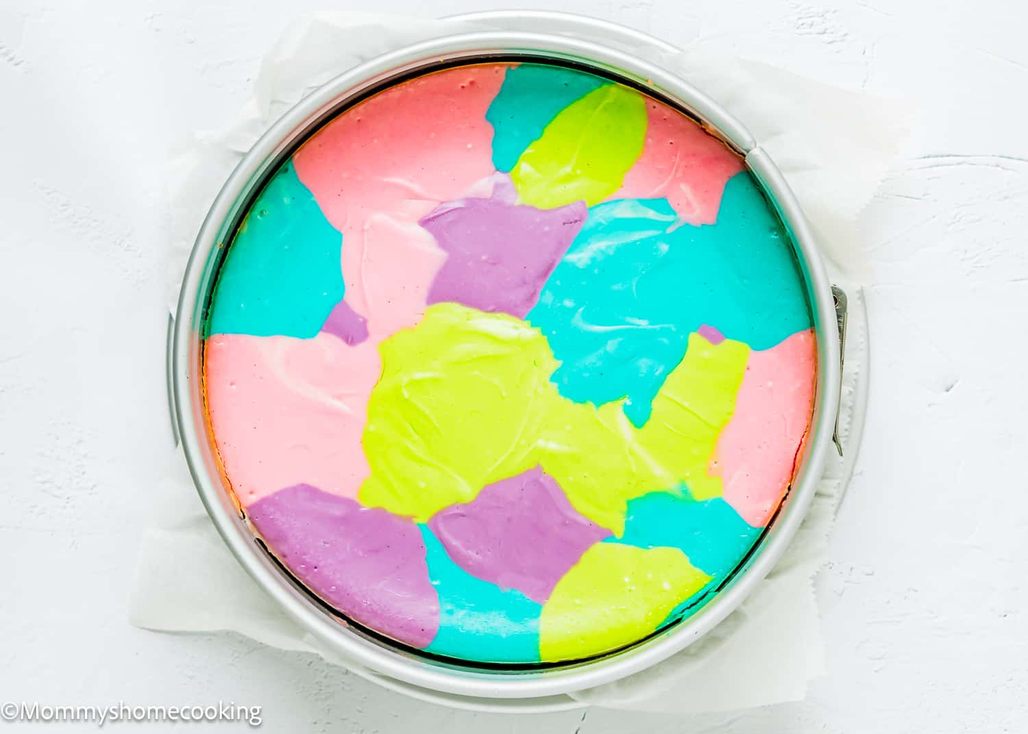 baked colorful cheesecake in a springform pan.