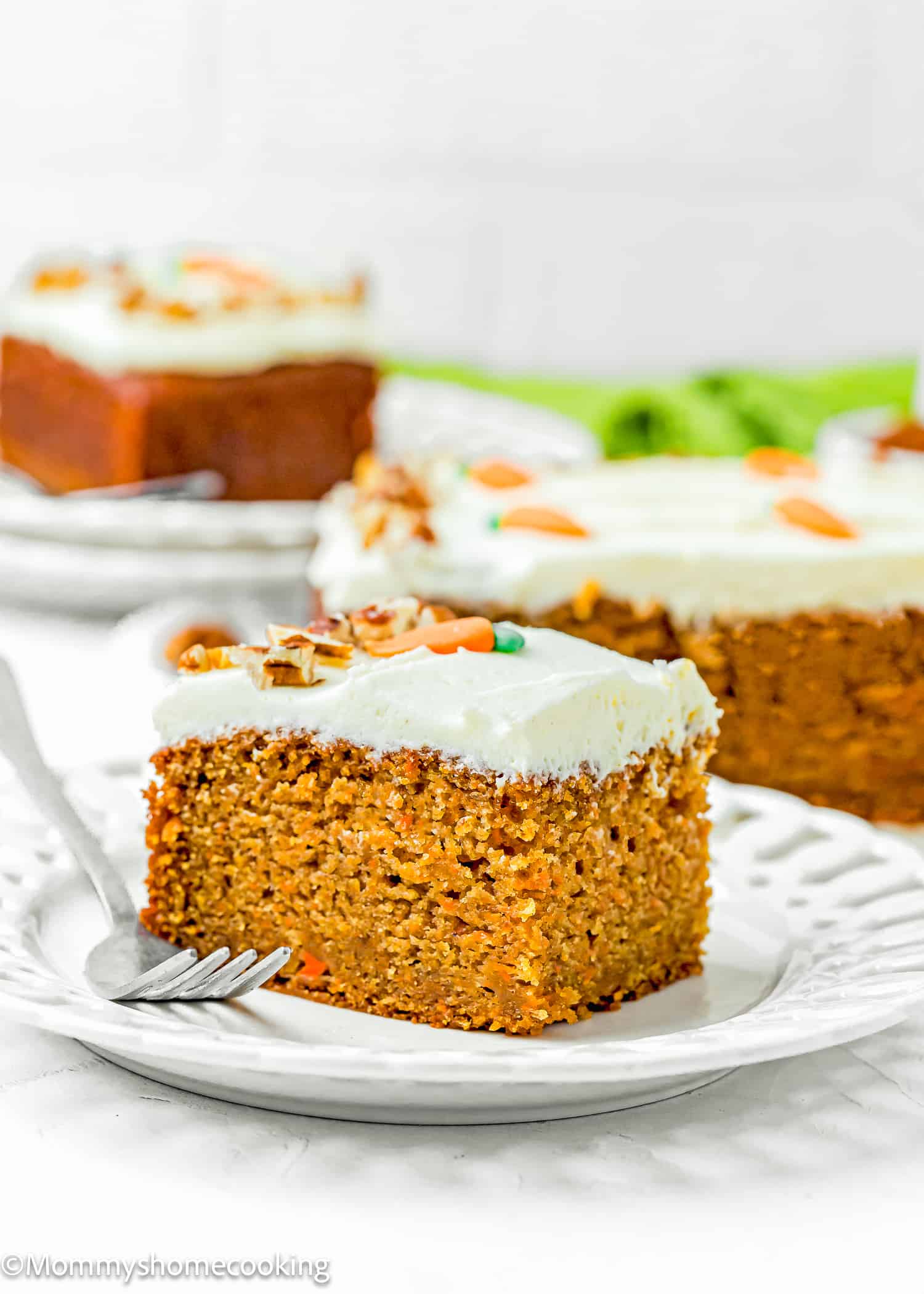 a slice of Easy Carrot Cake Snack Cake (No Eggs – No Dairy) on a plate with a fork.