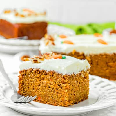 a slice of Easy Carrot Cake Snack Cake (No Eggs – No Dairy) on a plate with a fork.