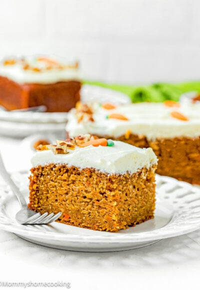 a slice of Easy Carrot Cake Snack Cake (No Eggs – No Dairy) on a plate with a fork.