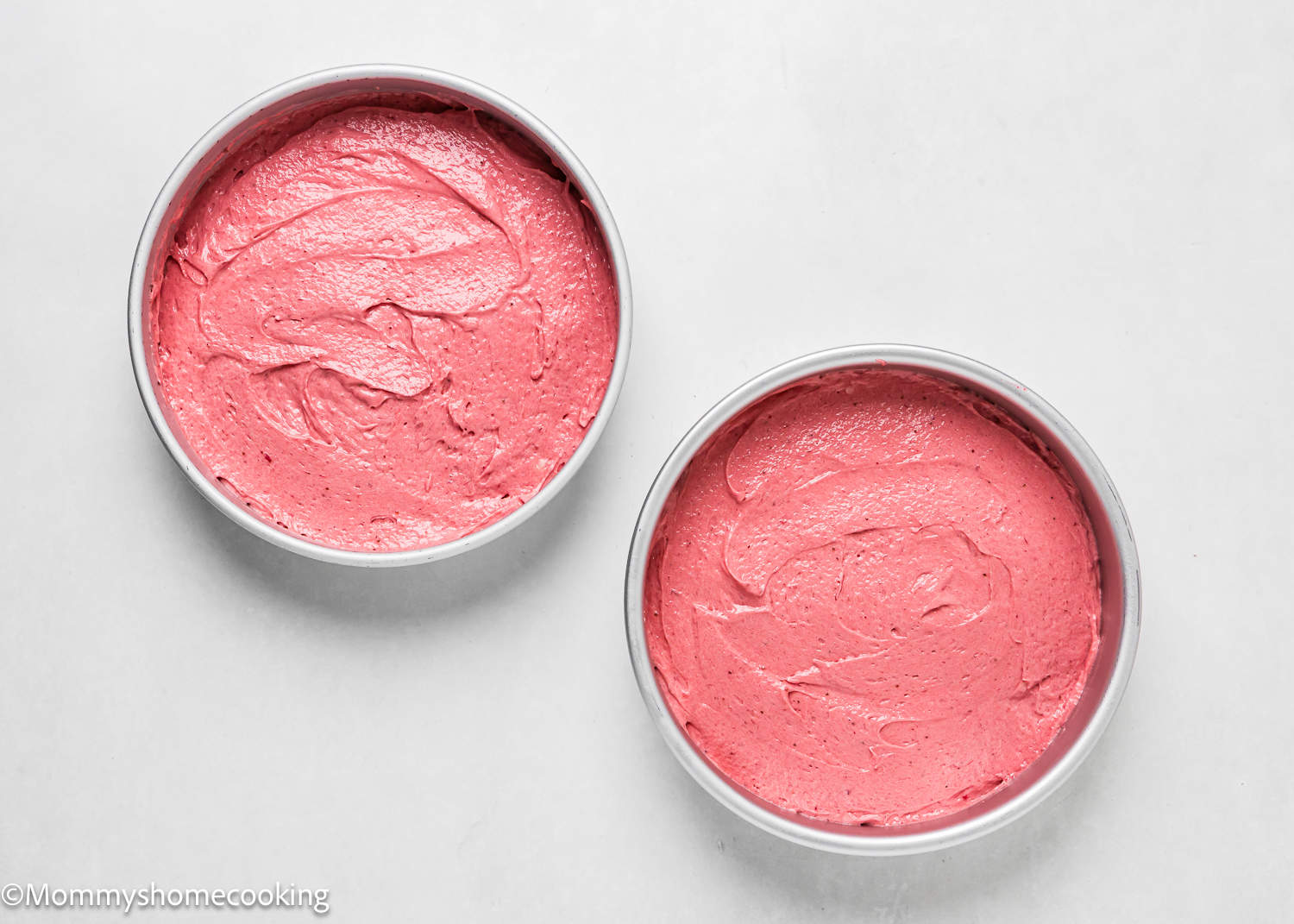 unbaked Easy Fresh Strawberry Cakes in cake pans.
