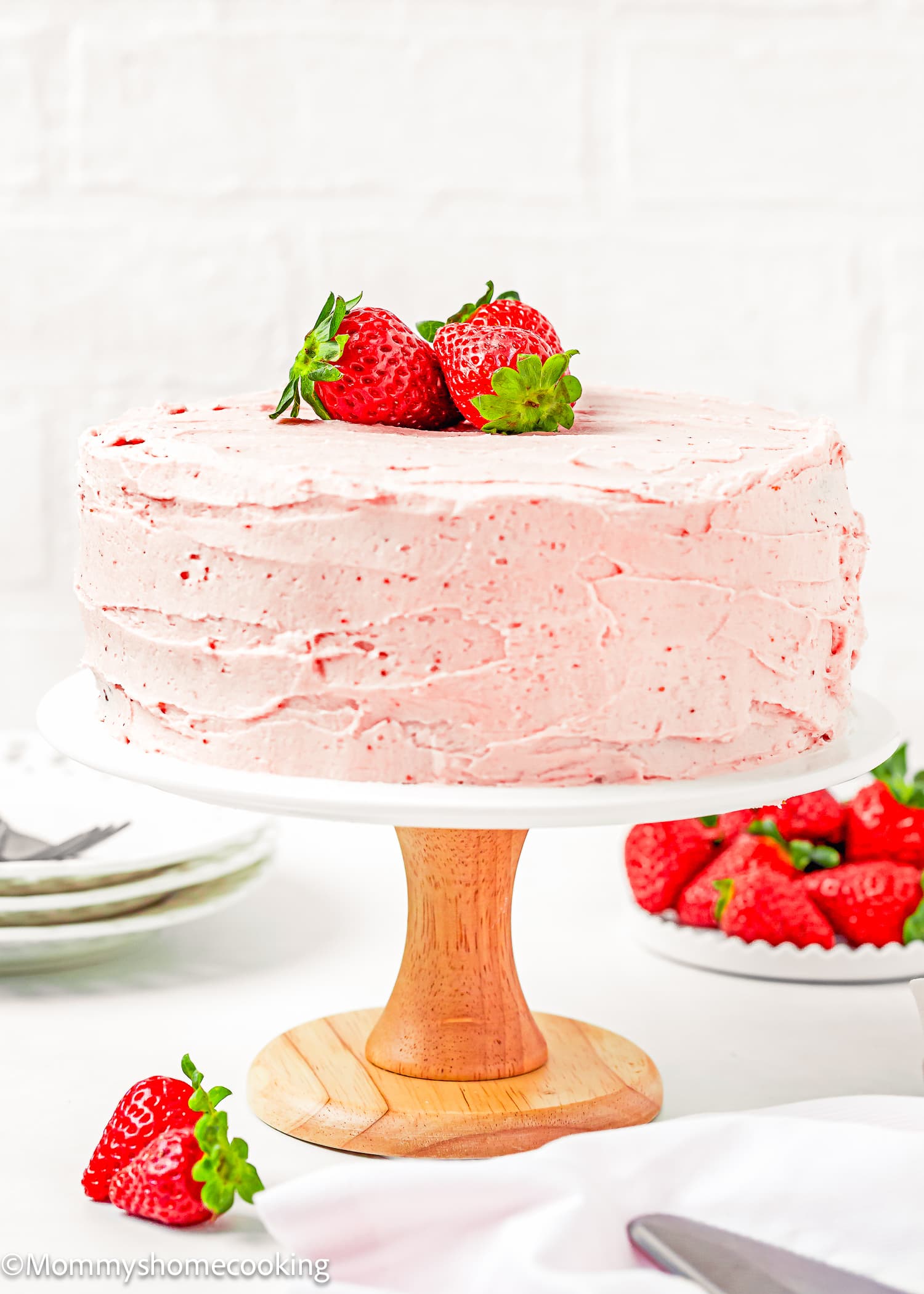 a whole Easy Fresh Strawberry Cake on a cake stand.