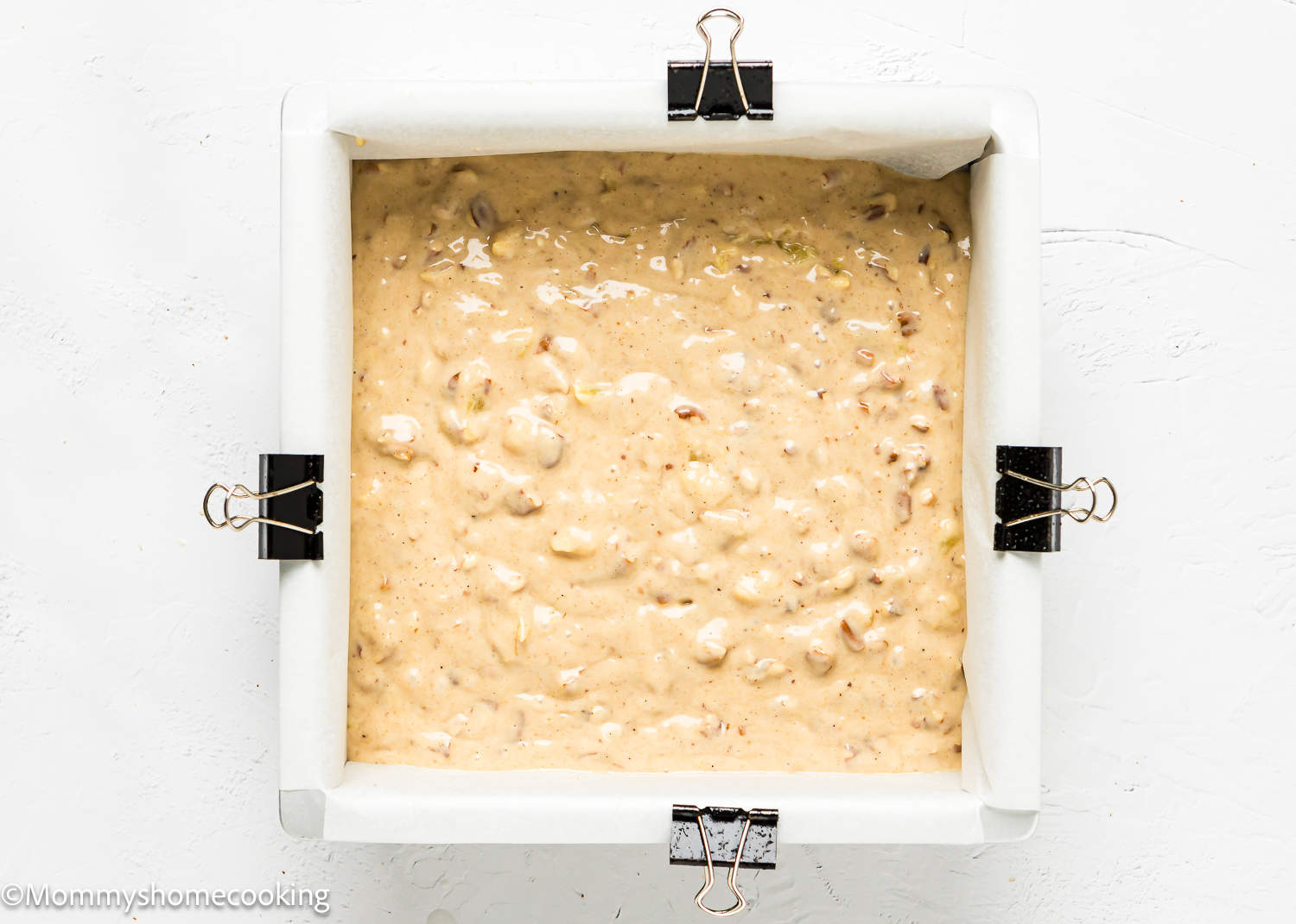 unbaked Hummingbird Cake in a square cake pan.