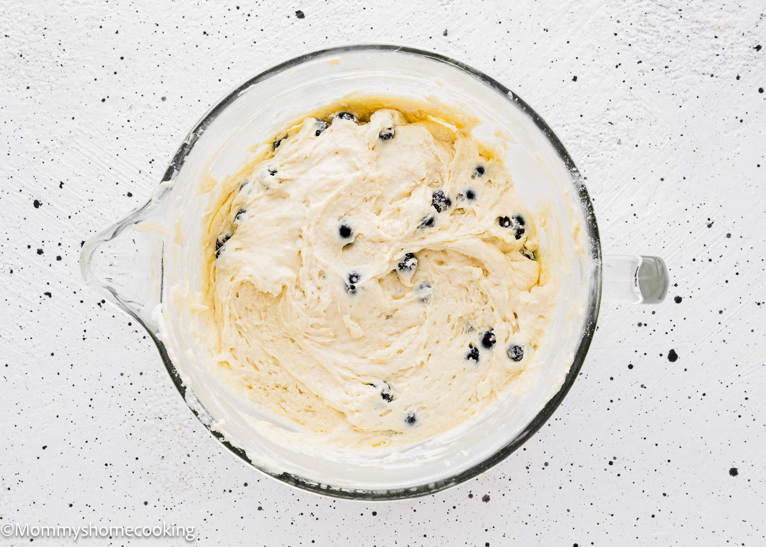 Eggless Lemon blueberry Loaf Cake batter in stand mixer bowl.