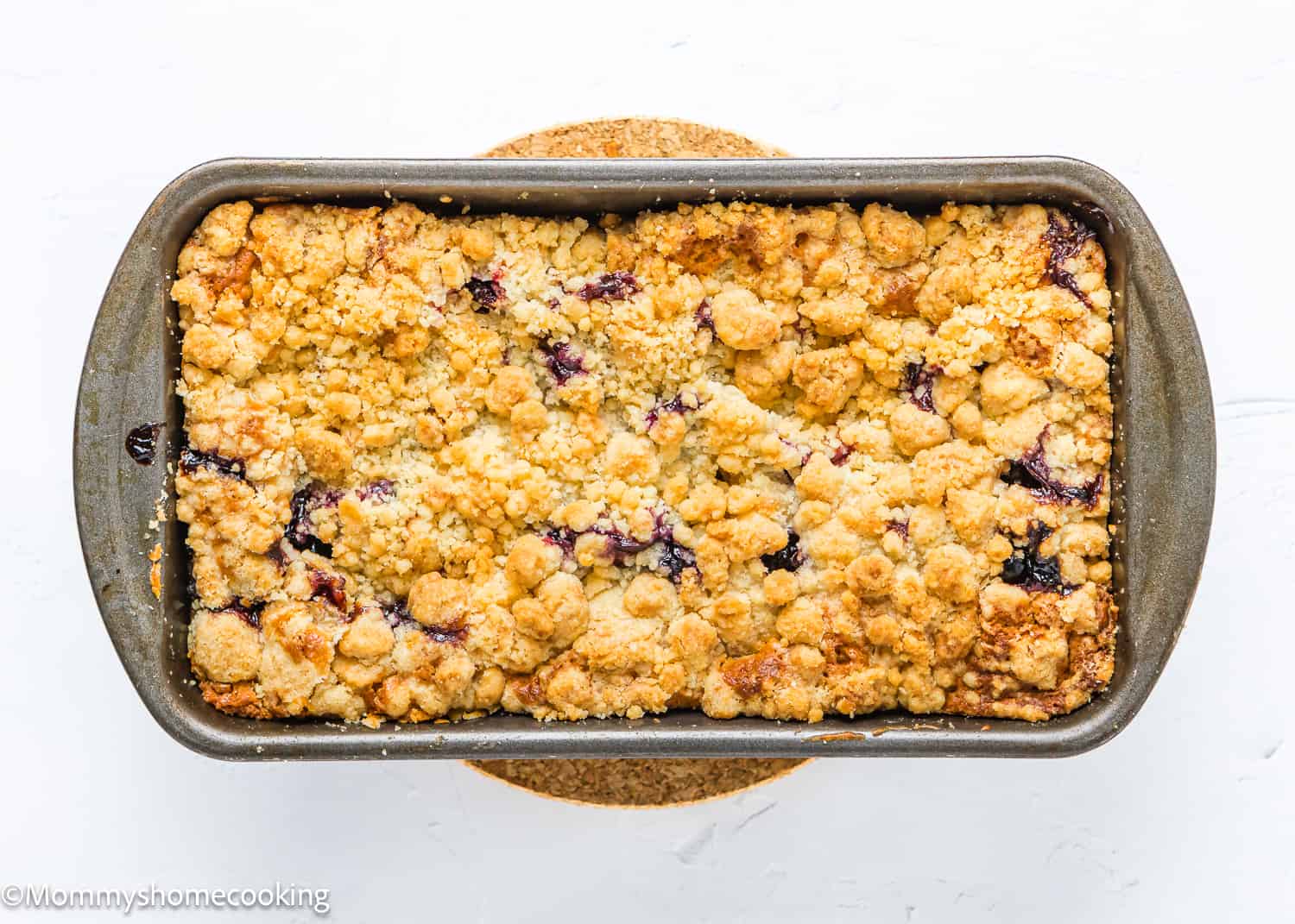 baked Eggless Lemon blueberry Loaf Cake in loaf pan.