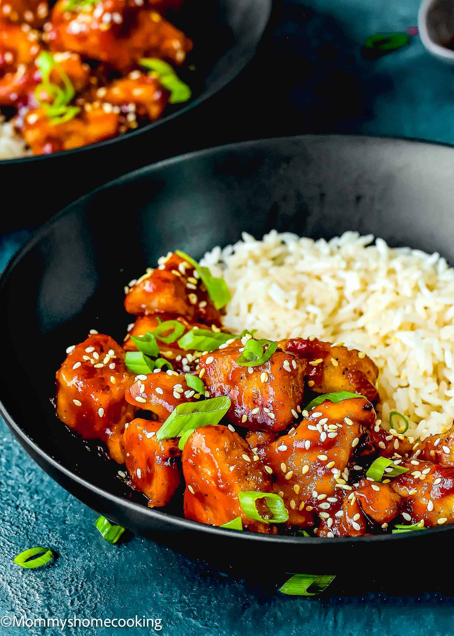 homemade Super Easy Orange Chicken made without eggs and rice in a bowl.