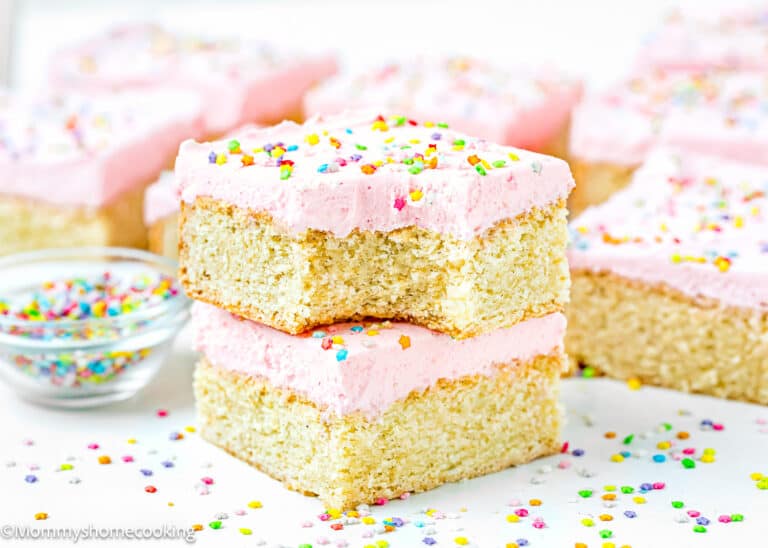 a stack of two Eggless Sugar Cookie bars, one bitten.