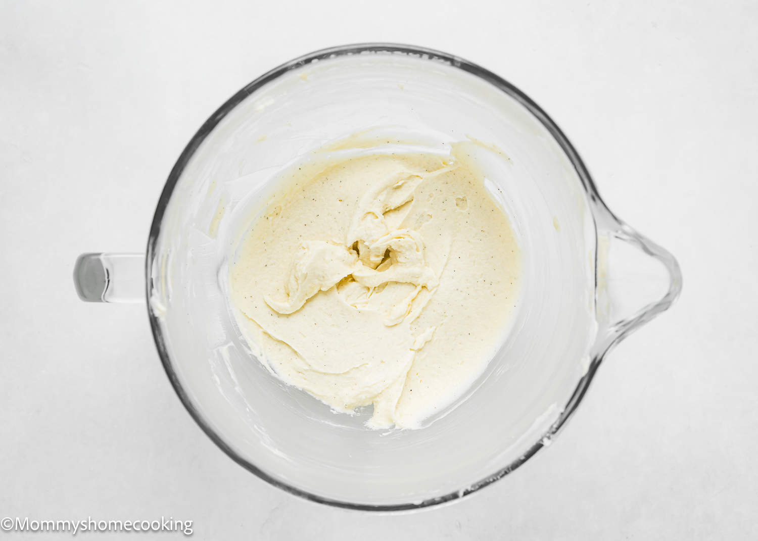 wet ingredients creamed together to make Eggless Sugar Cookie dough in a stand mixer bowl.