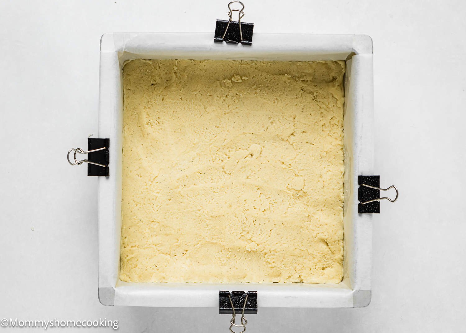 un baked egg-free sugar cookie dough in a square baking pan.