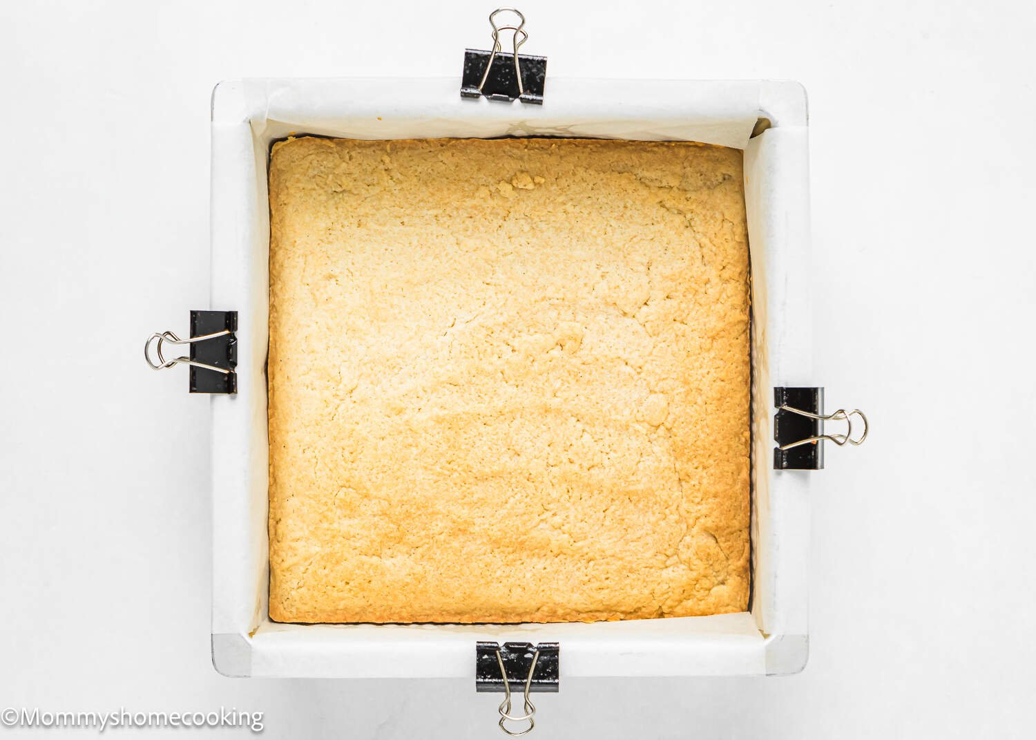 baked slab of egg-free sugar cookie bars in a square baking pan.