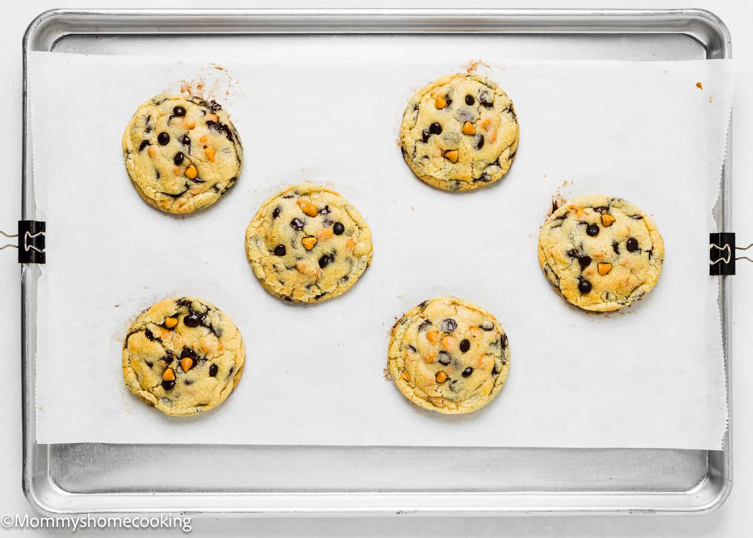 baked eggless Butterscotch Chocolate Chip Cookies on a baking tray.