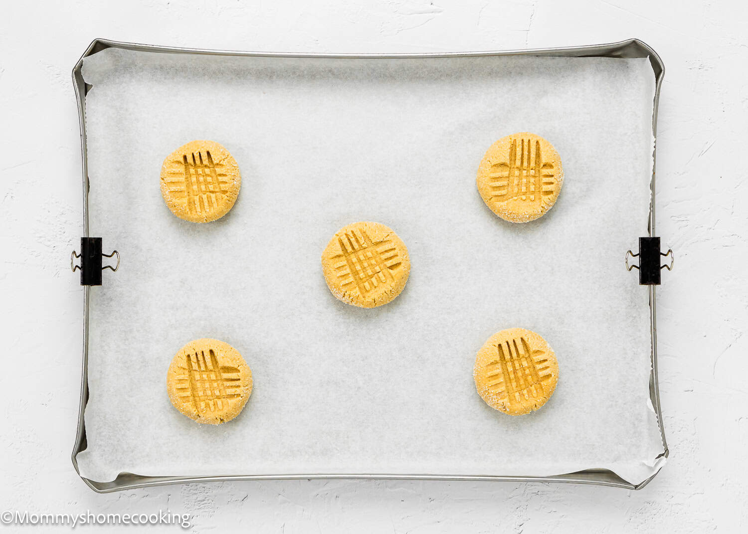 unbaked Egg-free Peanut Butter Cookies in a baking sheet.