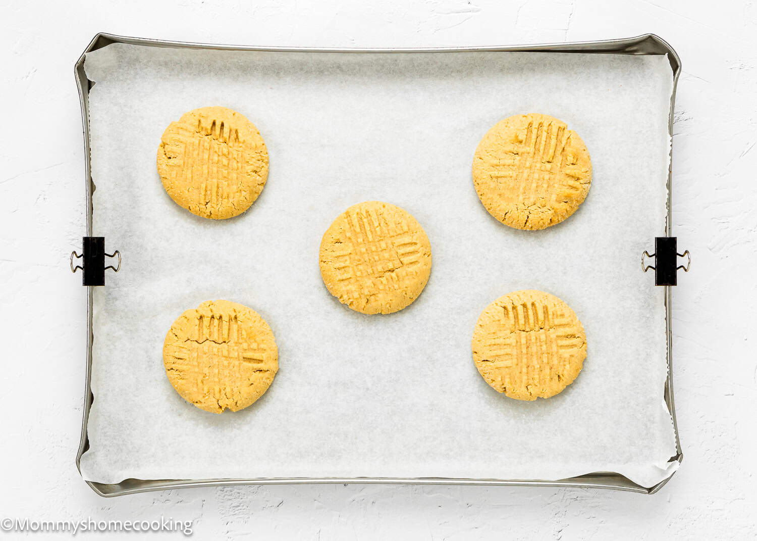 baked Eggless Peanut Butter Cookies in a baking sheet.