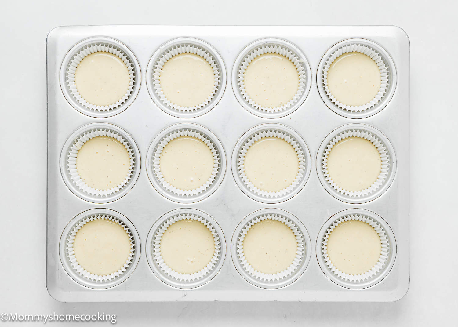 unbaked baked dairy-free and egg-free Vanilla Cupcake batter in a cupcake pan.