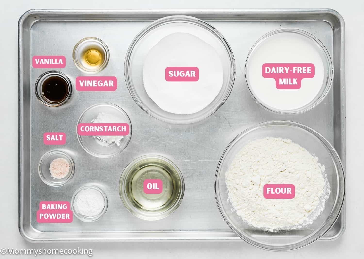 Ingredients needed to make dairy-free egg-free vanilla cupcakes with name tags.