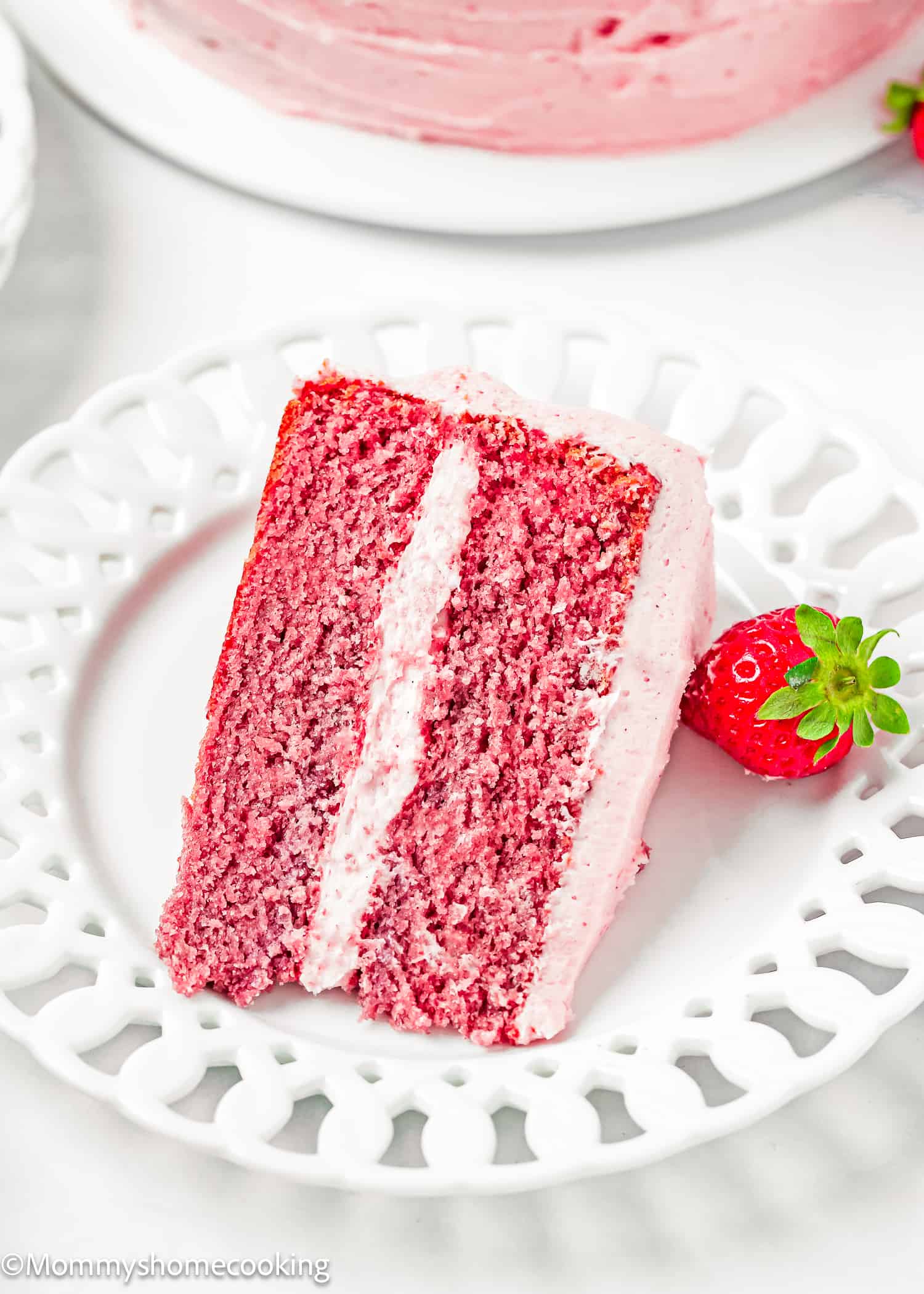 a slice of Easy Fresh Strawberry Cake made from scratch on a white plate.