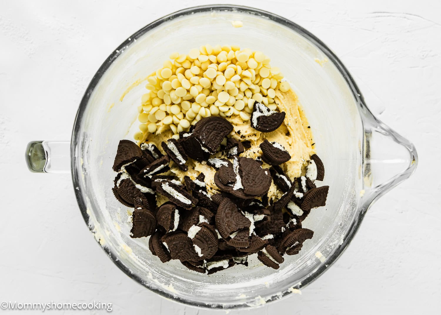 eggless Easy Oreo Blondies batter with white chocolate chip and chopped oreos in a stand mixer bowl.