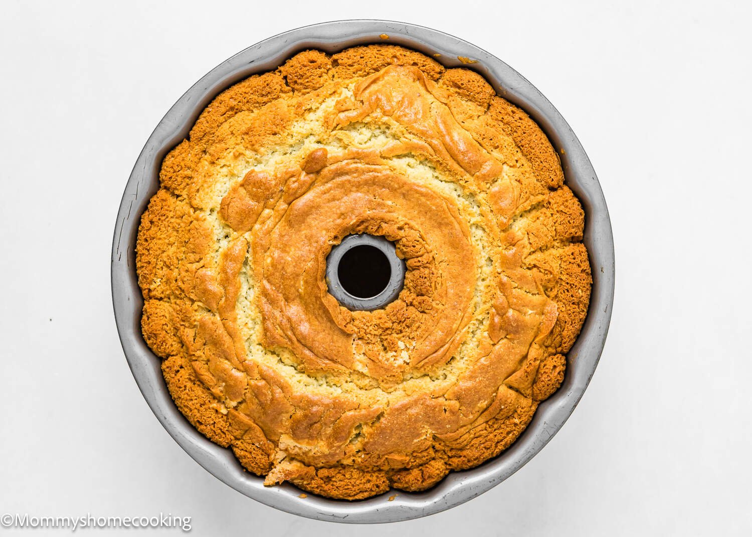 a baked Orange Bundt Cake in a bundt pan.