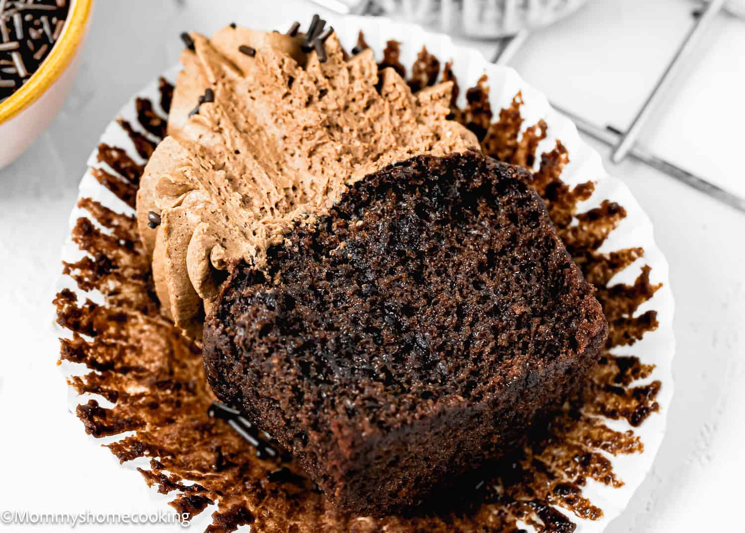 Easy Chocolate Cupcake cut in haft showing its fluffy inside texture.