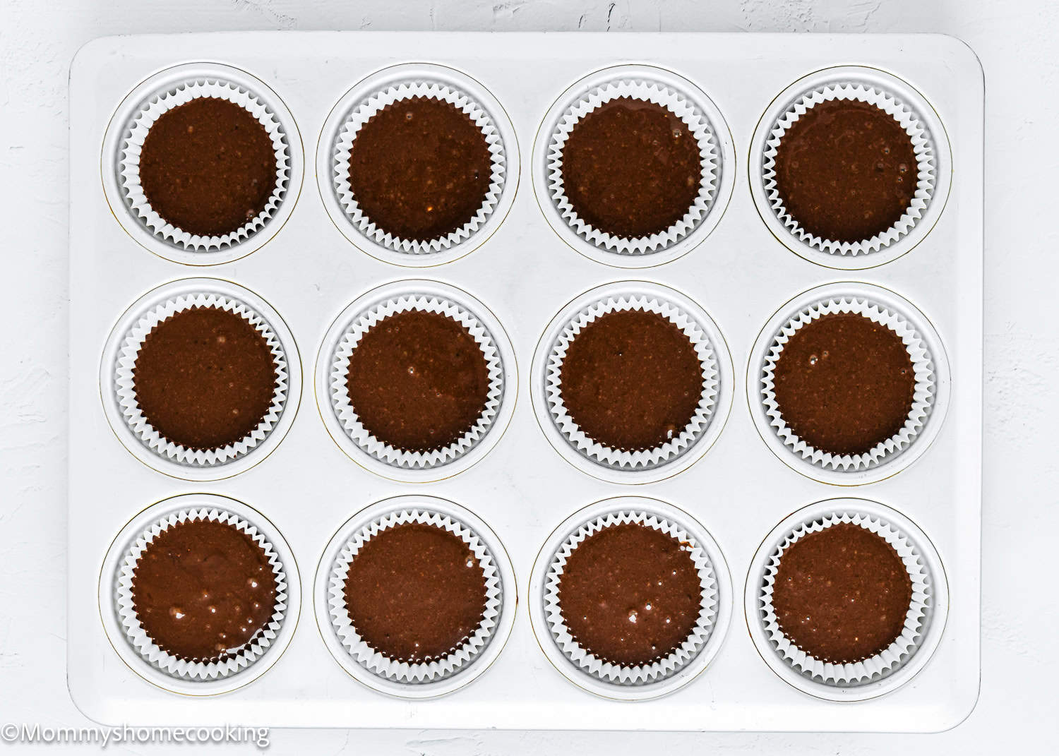 unbaked eggless, dairy-free Chocolate Cupcakes in a cupcakes pan.