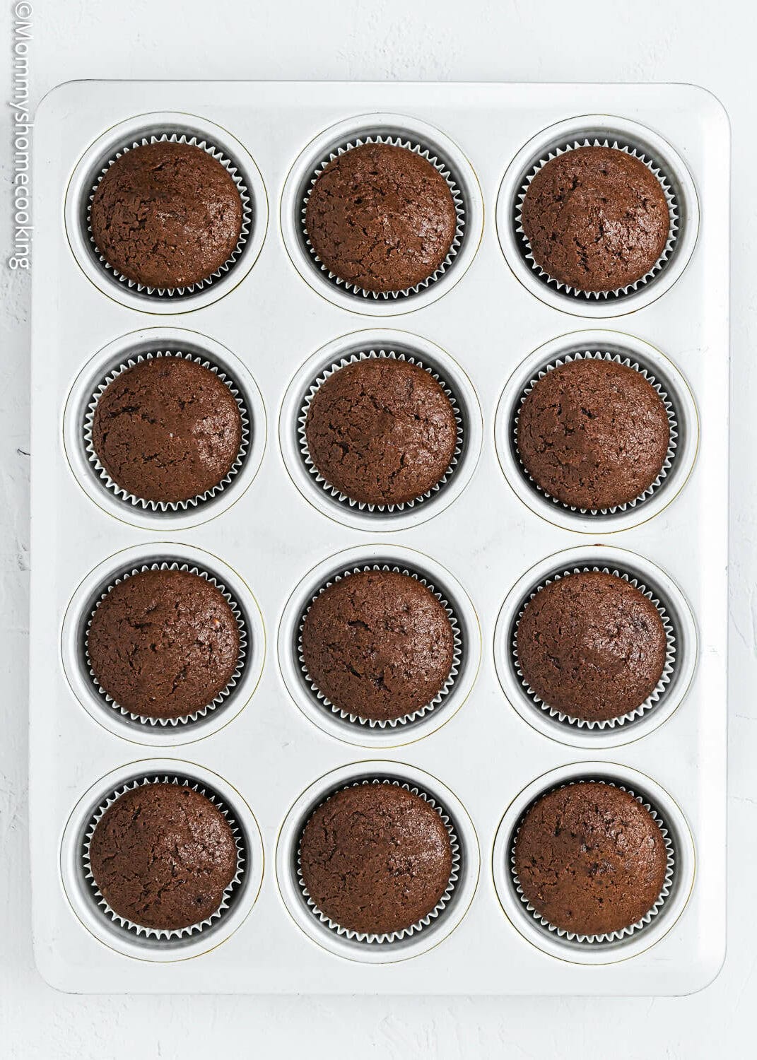 baked eggless, dairy-free Chocolate Cupcakes in a cupcakes pan.