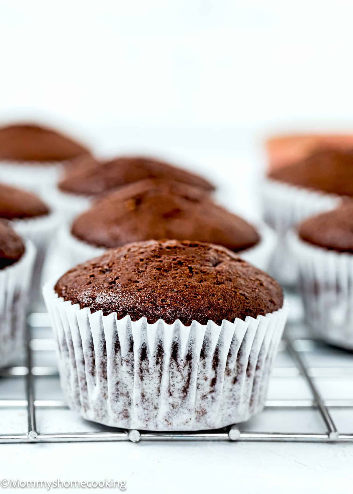 eggless, dairy-free and Easy Chocolate Cupcakes over a cooling rack.