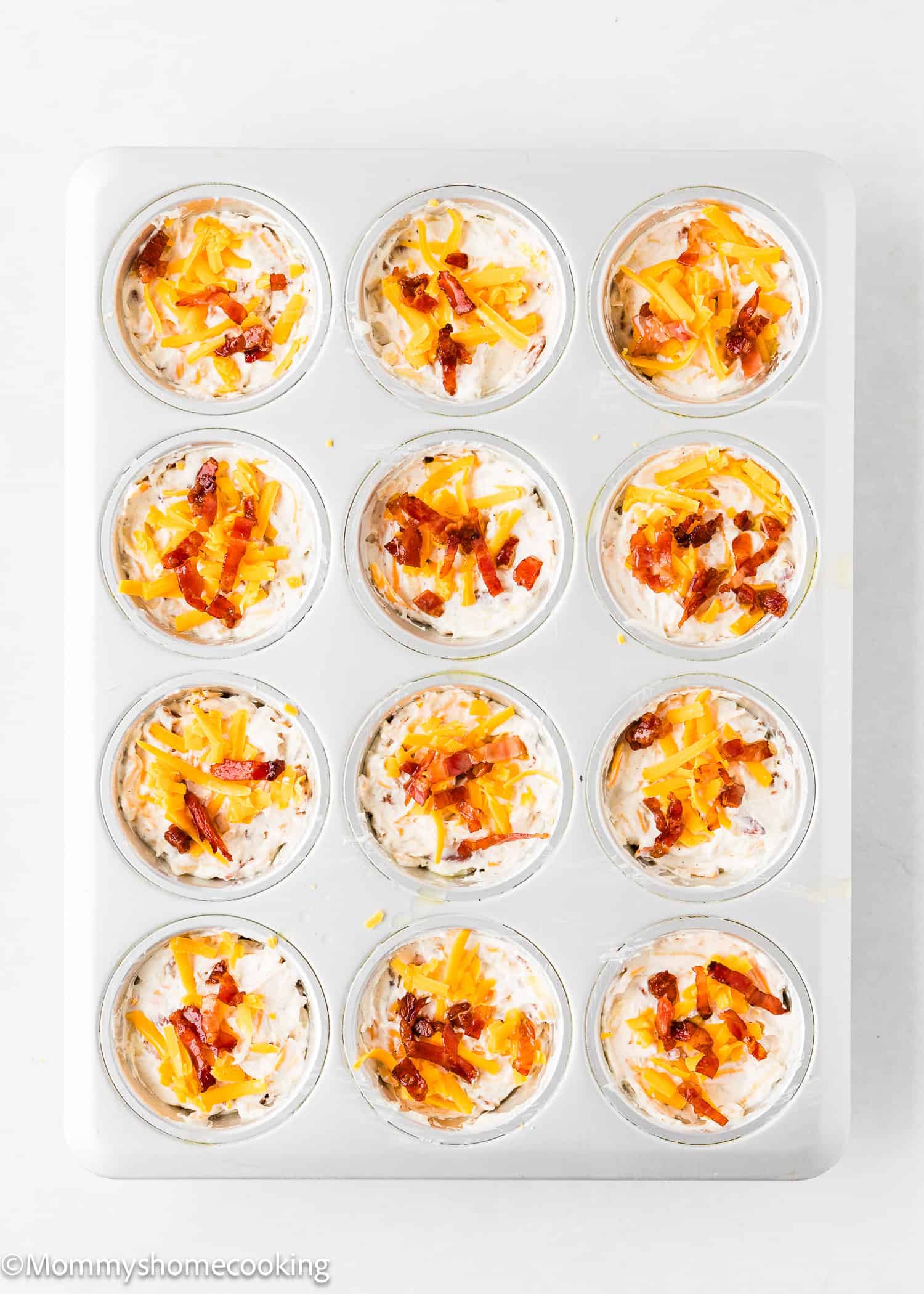 unbaked Breakfast Egg Muffins Without Eggs in a muffin pan.