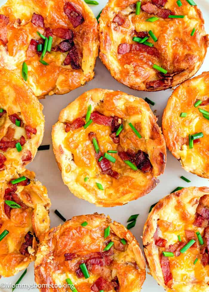 Egg-Free Breakfast Egg Cups with chopped chives on a plate.