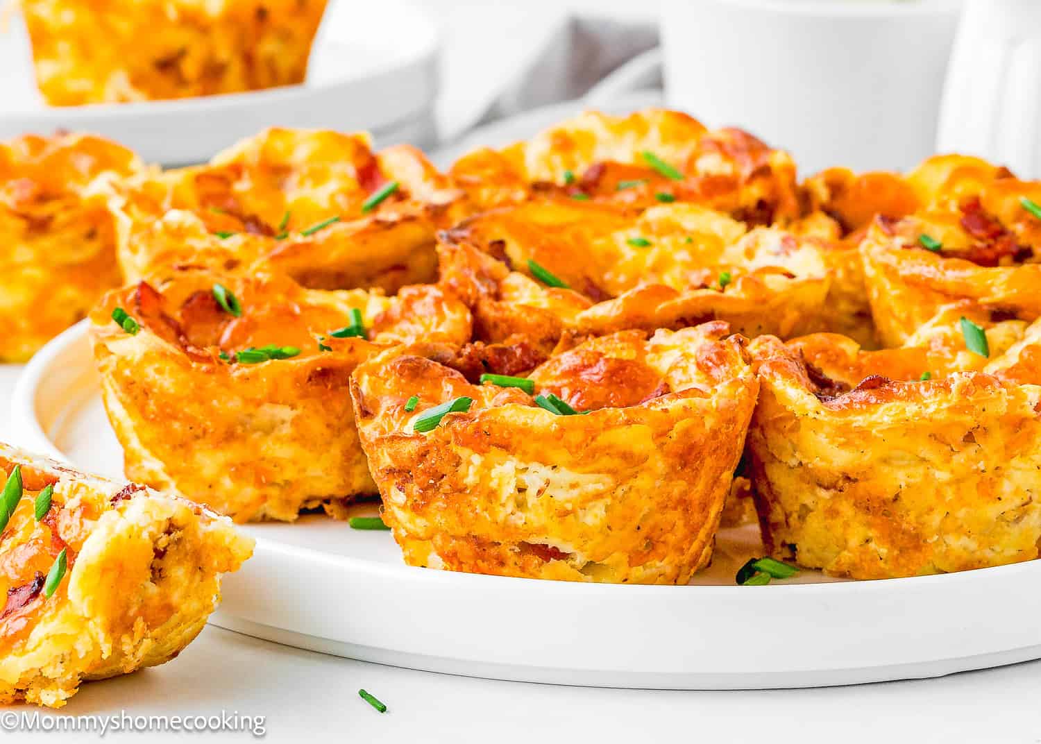 Breakfast Egg Muffins Without Eggs with chopped chives in a plate.