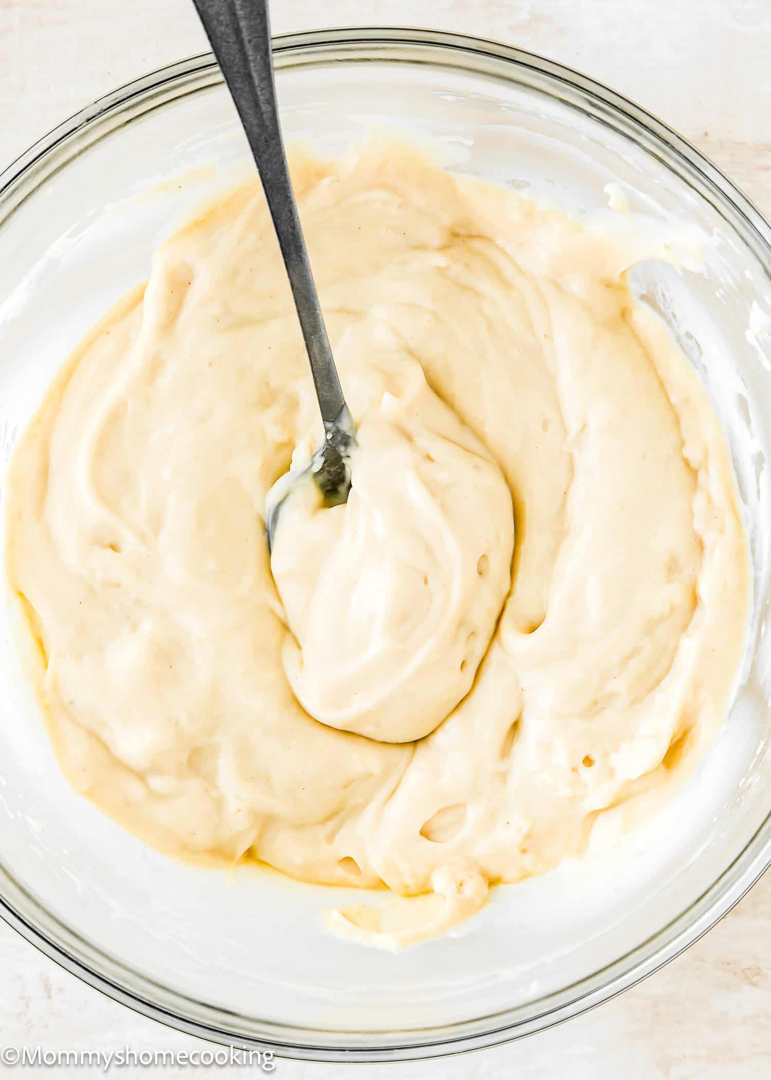 Vegan Pastry Cream in a bowl with a spoon.