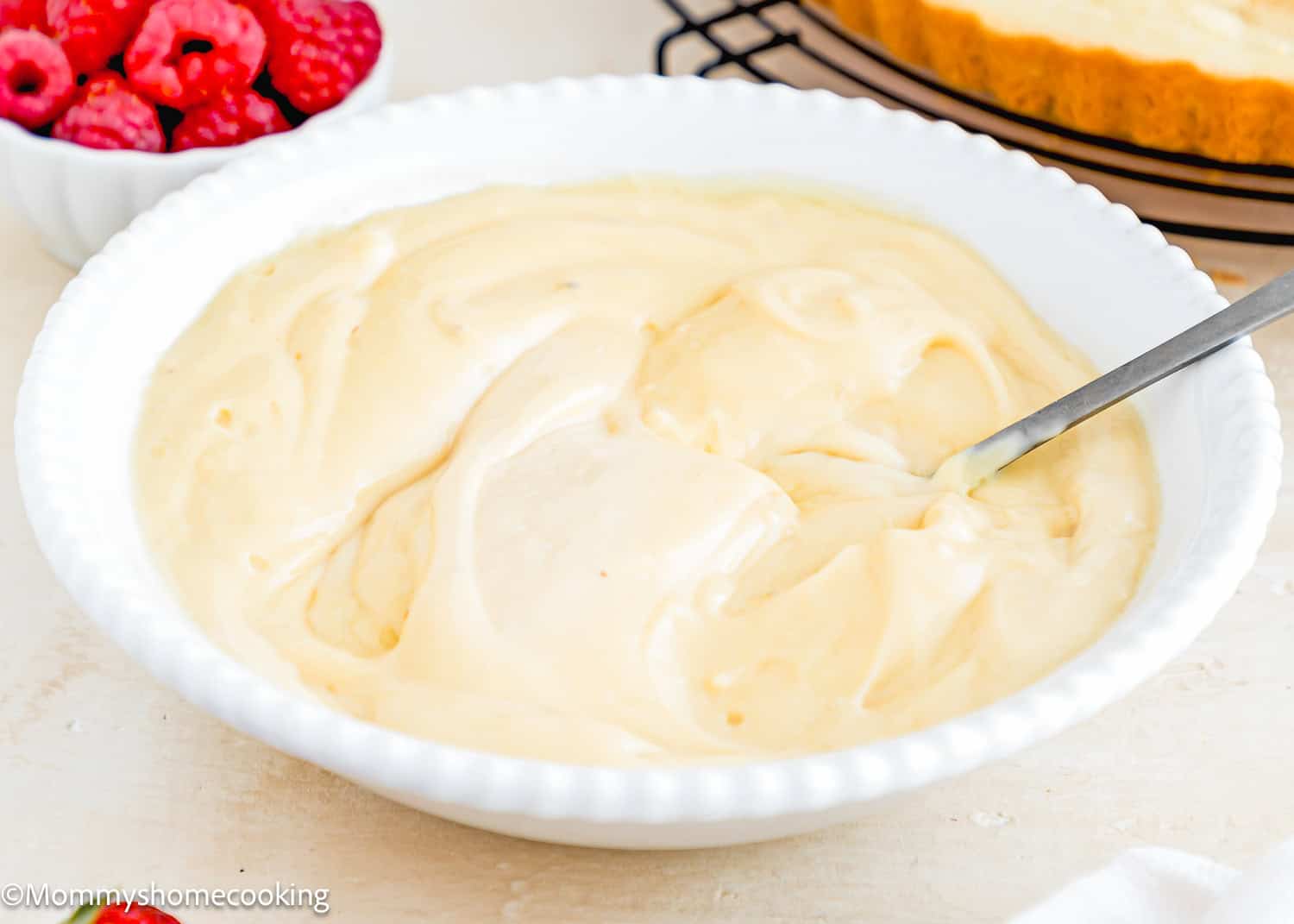 Vegan Pastry Cream in a bowl with a spoon.