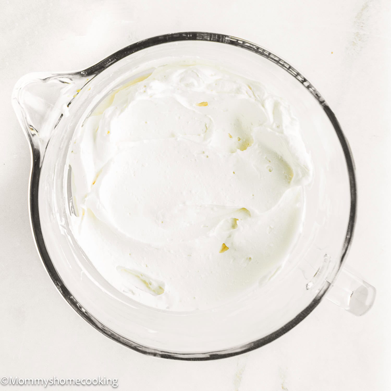 Easy Whipped Cream Frosting in a stand mixer bowl.