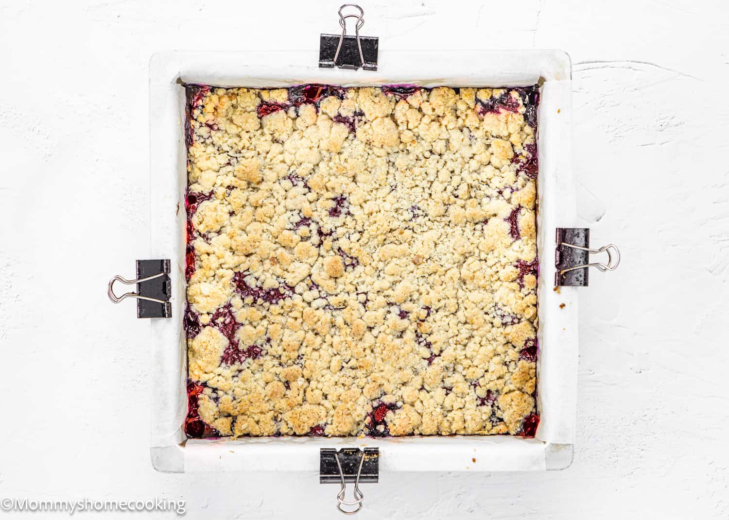 baked Eggless Strawberry Bars in a square baking pan.