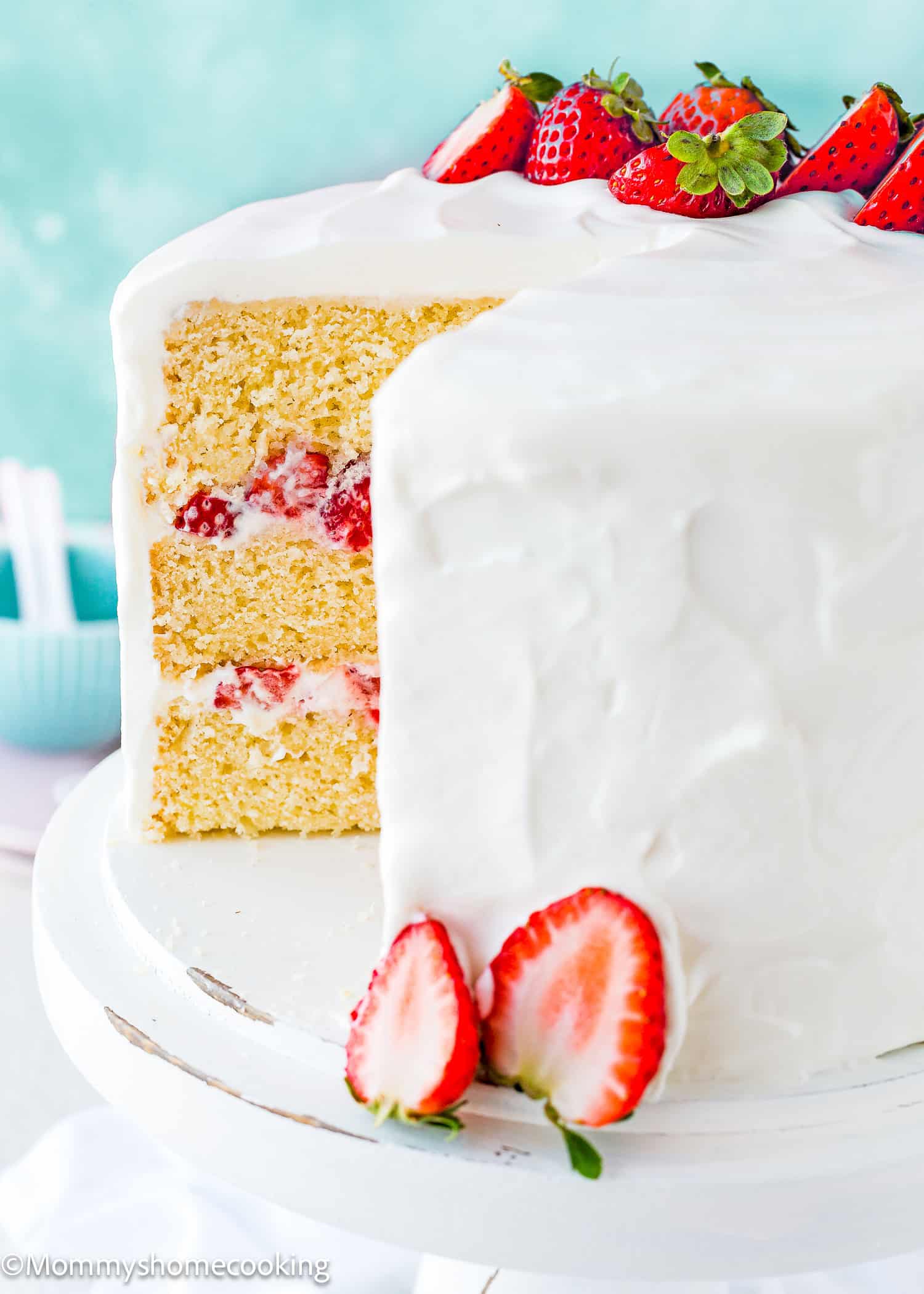 sliced Eggless Strawberry Shortcake Cake on a cake stand.