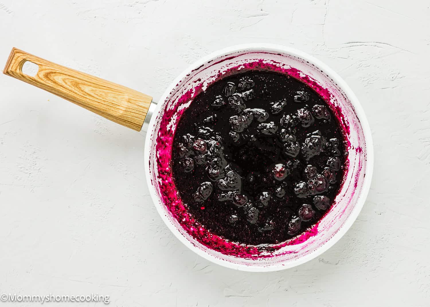Homemade Blueberry Sauce Topping in the making in a skillet.