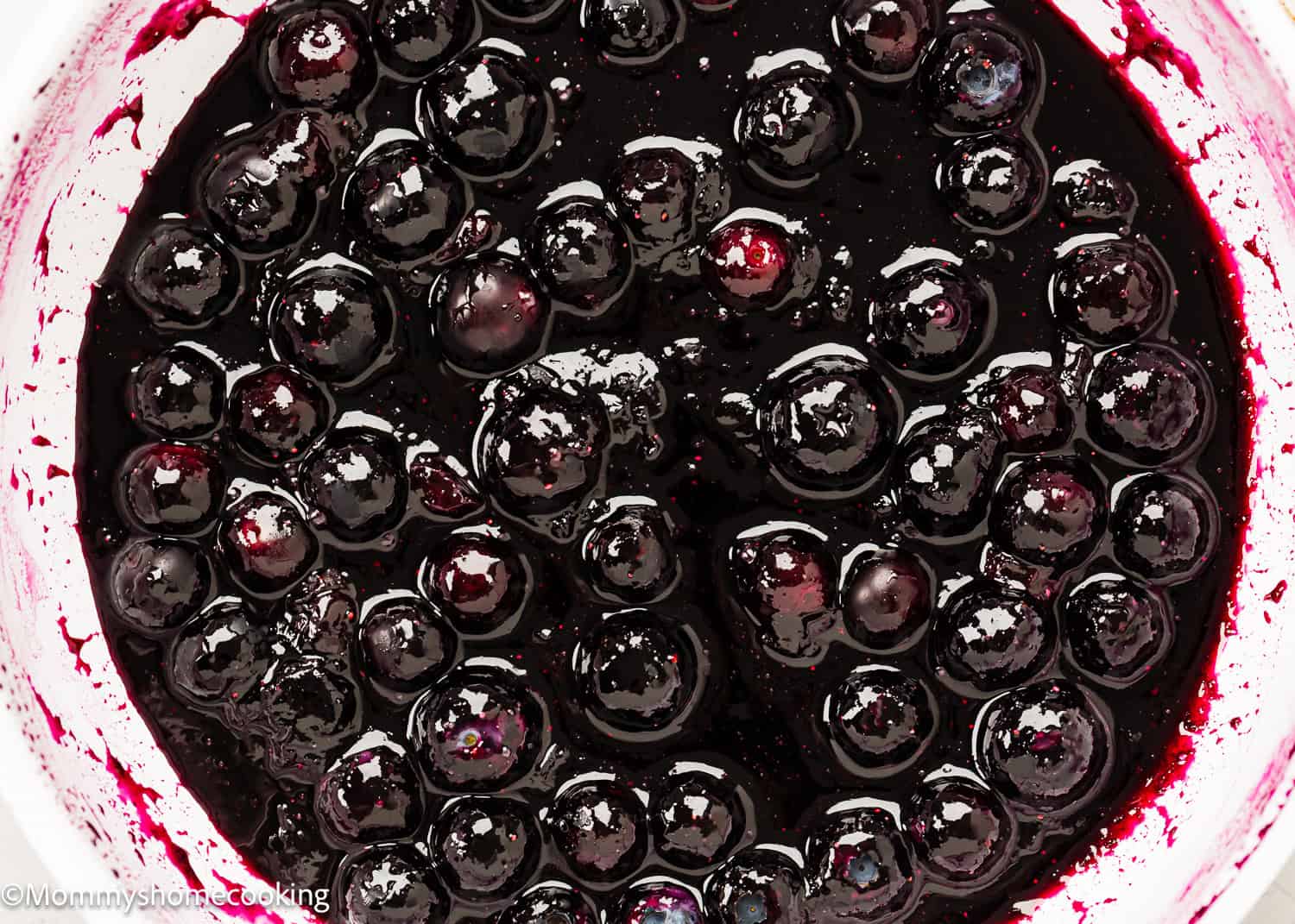 closeup of Homemade Blueberry Sauce Topping in a skillet.